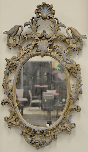 Two piece lot to include carved wood oval mirror, and arch top mirror with painted scene, 43" x 26" and 44" x 26".