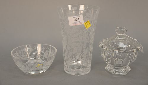 Three piece crystal group to include Baccarat covered crystal jar, Christofle orangerie crystal etched glass vase in original box, w...