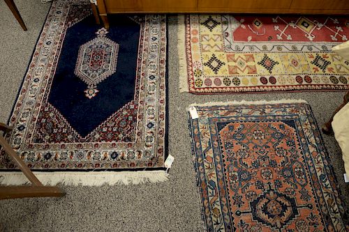 Three Oriental rugs. 3'11" x 6' 11", 3' x 5', 2'3" x 3'10". 