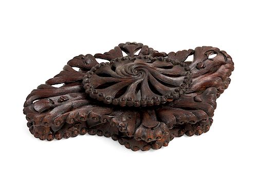 A Chinese Carved Wood Stand<br>decorated with whi