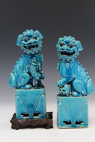Pair of Chinese blue glazed porcelain figures of foo dogs.