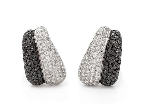A Pair of 18 Karat White Gold, Diamond and Black Diamond Earrings,