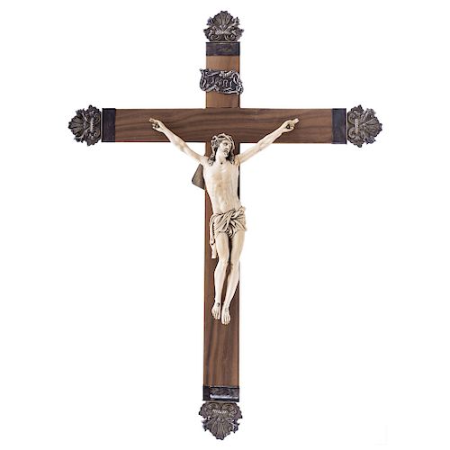 CHRIST CRUCIFIED. FRANCE, 19TH CENTURY.  Carved ivory on a wooden crucifix (from a later stage) and silver details. 
