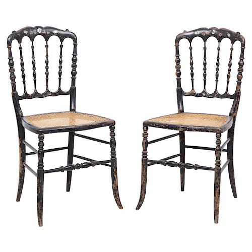 A PAIR OF CHAIRS. ENGLAND, CIRCA 1900. Victorian Style. Ebonised wood with mother-of-pearl and hand-painted details. Cane seats.