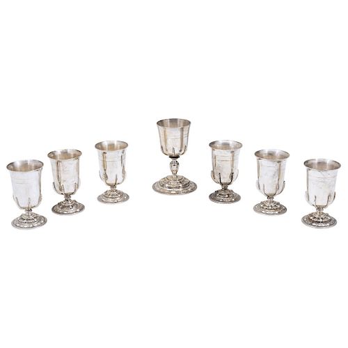 TROPHY SET. MEXICO, 20TH CENTURY.  Sterling 0.925 Silver. Brand: SANBORNS. The body chased and with repoussé. One of them with an inscription. 7 piece