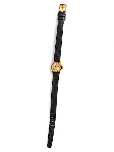 An 18 Karat Yellow Gold Wristwatch. Tiffany and Co.,