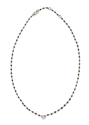 An 18 Karat Bicolor Gold, Black Diamond and Diamond Necklace,