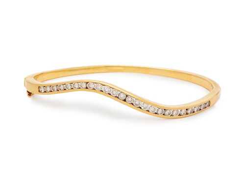 A 14 Karat Yellow Gold and Diamond Bangle Bracelet,