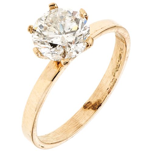 A diamond 14K yellow gold solitaire ring.