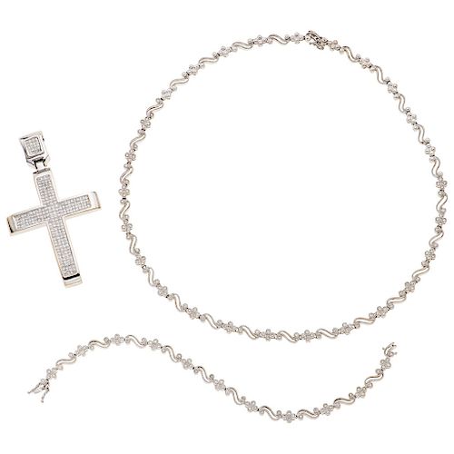 A diamond 14K white gold cross pendant and choker and bracelet set.