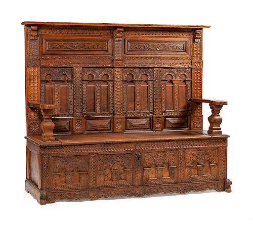 A Continental Carved Oak Settle