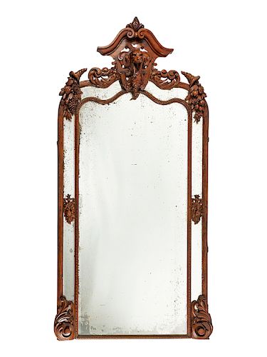 A Monumental Black Forest Carved Mirror