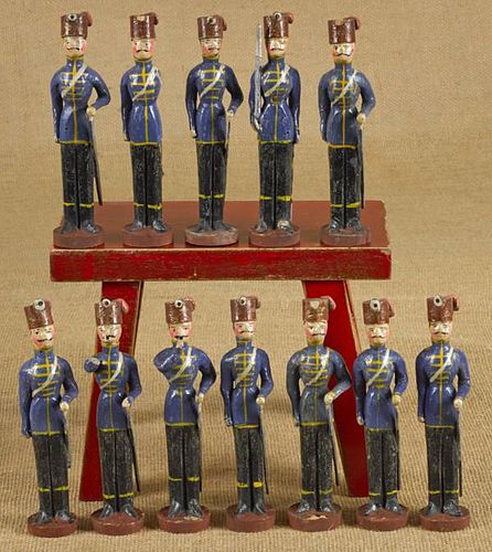 Set of twelve carved and painted wooden soldiers,