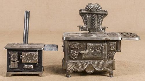 Two cast iron toy stoves, one J. & E. Stevens Co.