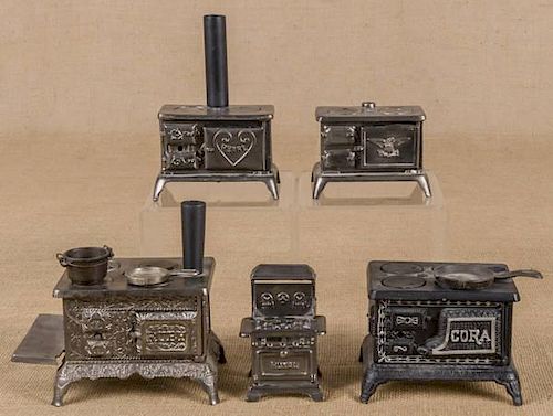 Five cast iron toy stoves, to include a Grey Iron