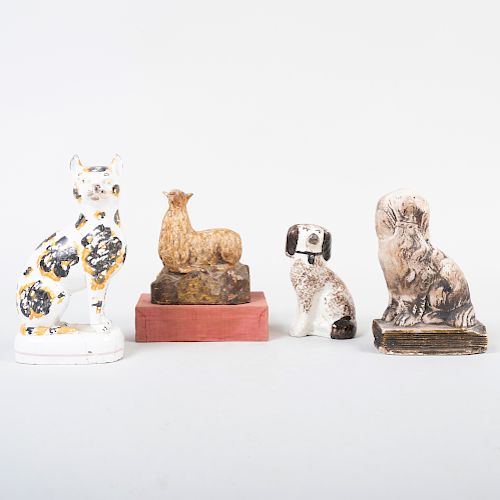 Staffordshire Model of a Spaniel and a Cat, a Chalkware Model of a Spaniel, a Carved Wood Figure of a Sheep