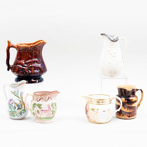 Group of Six Porcelain and Pottery Pitchers