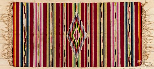 Tribal throw rug, 22'' x 46''.