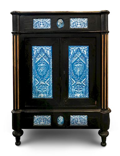 A Continental Blue Faience-Mounted Ebonized Cabinet
