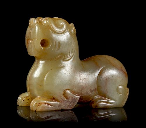 A Celadon and Russet Jade Mythical Beast
Height 1 1/2 in., 4 cm. 