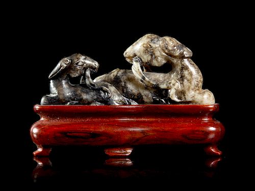 A Grey and Black Jade Figural Group of Double Rams
Length 3 1/4 x height 1 1/2 in., 8 x 4 cm. 