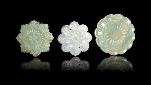 Three Celadon Jade Floriform Pendants
Widest: width 2 1/2 in., 6 cm. 