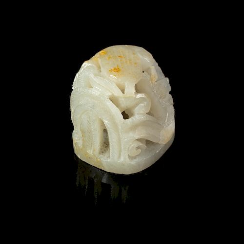 A Carved Russet and White Jade Hat Finial
Height 1 1/2 in., 4 cm. 