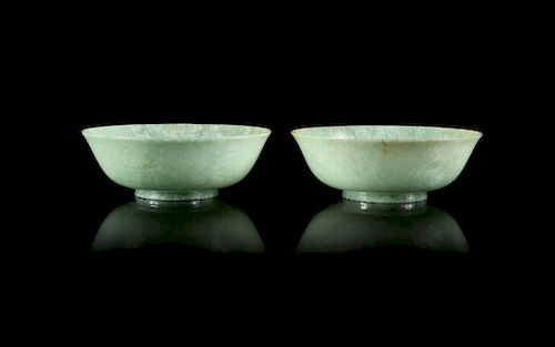 A Pair of Mottled Apple Green Jadeite Bowls
Each: height 1 3/4 x diam 5 1/4 in., 4 x 13 cm. 