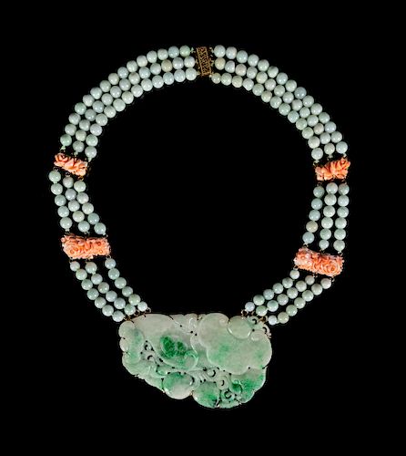 A Jadeite Beaded Necklace
Length 15 in., 38 cm. 