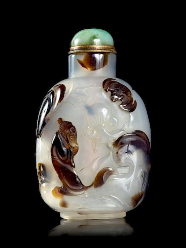 A Silhoutte Carved Agate Snuff Bottle
Height 2 3/8 in., 6 cm. 