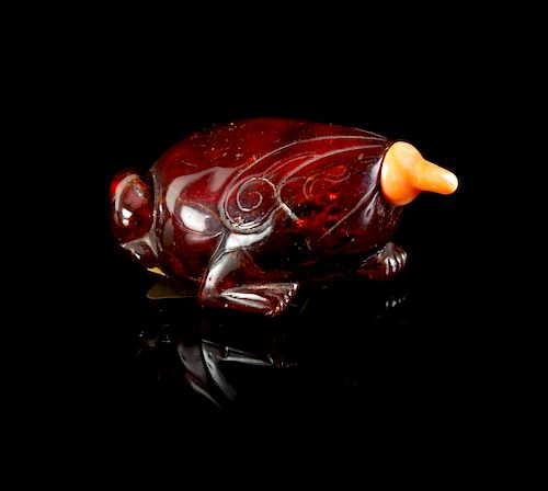 An Amber Frog-Form Snuff Bottle
Height 2 1/2 in., 6 cm. 
