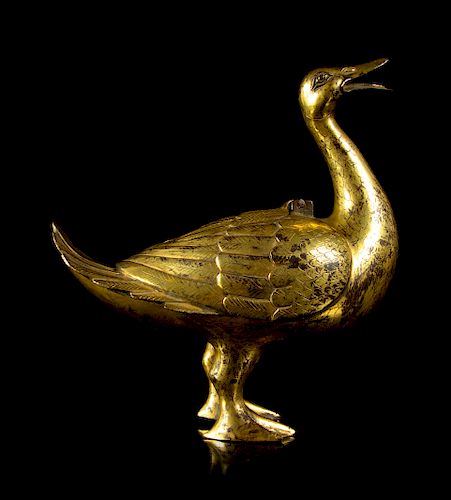 A Gilt Bronze Duck-Form Incense Burner
Height 9 in., 23 cm. 