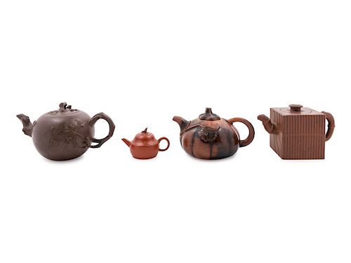 Four Yixing Pottery Teapots
Largest: length 7 3/4 in., 20 cm.