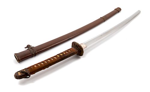 A Japanese Katana
Blade length 22 1/2 in., 57 cm. Overall length 37 1/2 in., 95 cm. 