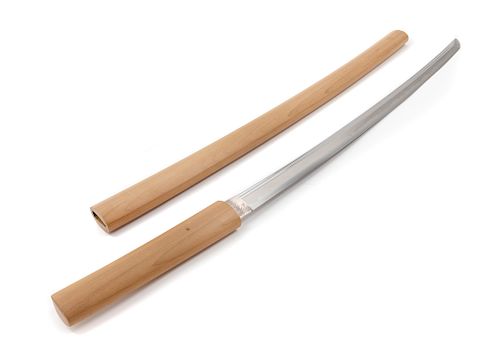 A Japanese Katana
Blade length 26 in., 66 cm. Overall length 35 1/2 in., 90 cm.