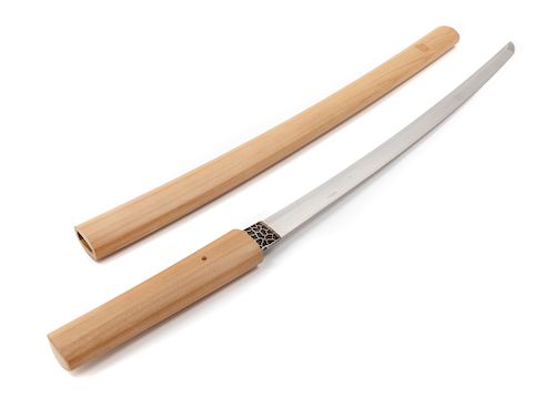 A Japanese Katana
Blade length 21 1/4 in., 54 cm. Overall length 30 1/8 in., 77 cm.