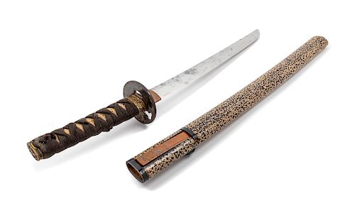 A Japanese Katana
Blade length 13 3/4 in., 35 cm. Overall length 27 1/4 in., 69 cm.