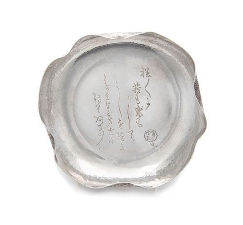A Japanese Silver Flori-Form Plate
 Length 7 1/2 in., 19 cm., weight 8.0 dwts.