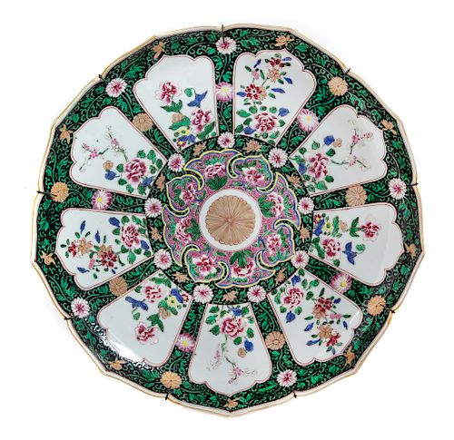A Japanese Polychrome Enameled Porcelain Flori-Form Plate
Diam 15 3/4 in., 40 cm.