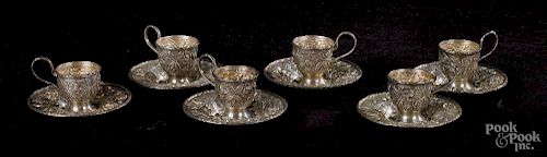 Six sterling silver demitasse cups and saucers