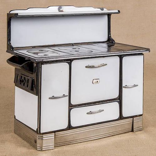Cast iron and enameled toy stove, 16'' h., 17'' w.