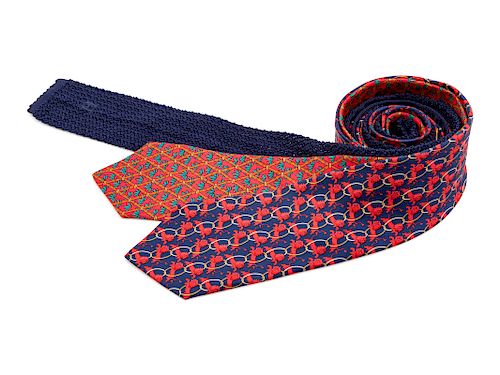 Three Hermes ties, one red, one blue, one blue knit tie