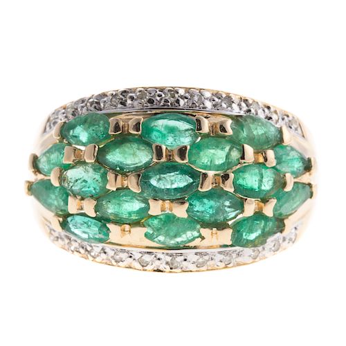 A Ladies Emerald and Diamond Wide Band in 14K