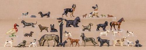 Twenty-eight cast iron, spelter, and metal dogs,