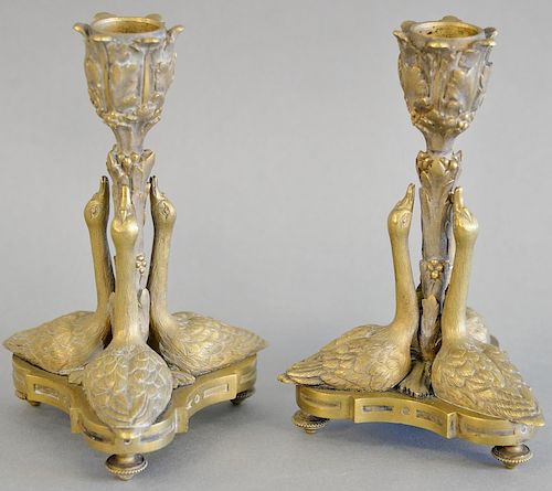 Pair of continental neoclassical figural candlesticks having supports in the form of three swans on turned feet. ht. 6 1/2 in., wd. ...