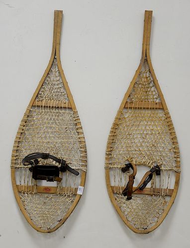 Pair of Faber snowshoes, one part of leather mount missing. lg. 42 in.