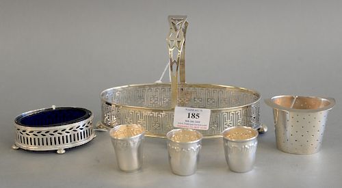 Sterling silver six piece lot to include salt with cobalt pierced stand for sugar basket , tea strainer, three shot glasses, etc. 7....