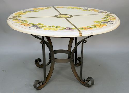 Ceccarelli Italian majolica ceramic round table painted with fruits and leaves, signed Ceccarelli on iron base. ht. 30 in., dia. 50 in.