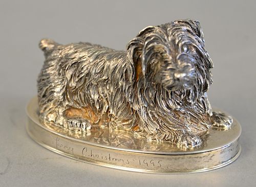English silver dog on oval base marked "Lily Merry Christmas 1995". ht. 2 in., wd. 3 1/4 in., dp 2 in., 6.7 t.oz