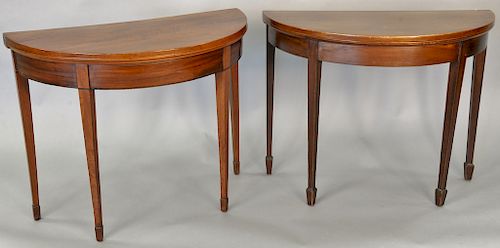 Two George III mahogany demilune game tables with square tapering legs, late 18th century, ht. 28 1/2 in., wd. 36 in., dp. 17 1/2 in.